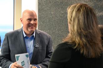 UFT President Michael Mulgrew (left) discusses union legislative priorities on behalf of the members during the UFT's legislative reception in Albany. 