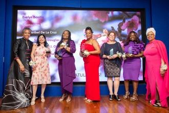 A group of award winners take a photo on the stage at the 2024 Provider Appreciation Awards Ceremony at UFT Headquarters on May 10, 2024.