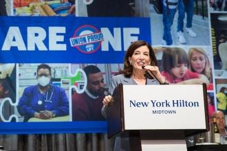 A woman speaks at the podium