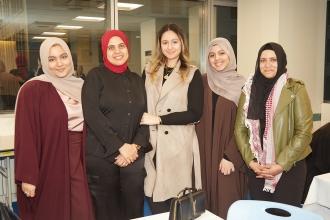 A group of women in attendance at the 2024 UFT Muslim Educators Committee Iftar Dinner take a photo.