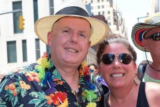 A man and woman pose together for a photo