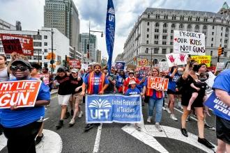 A group of UFT members are photographed walking down the street 