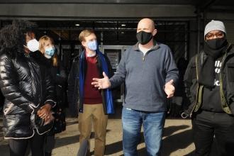 A group gathers to talk about the event taking place. 