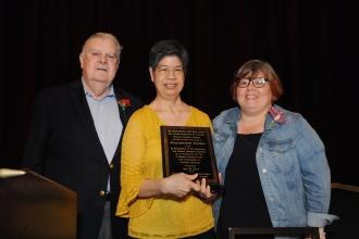 A retiree accepts an award at the 2024 UFT Retired Teachers Chapter Luncheon