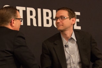 Mike Morath shakes hands with someone on stage