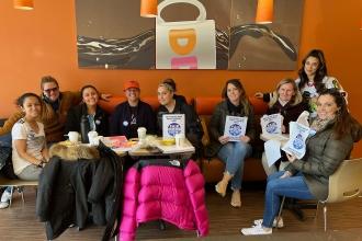 A group of UFT members hold their grade in at Dunkin