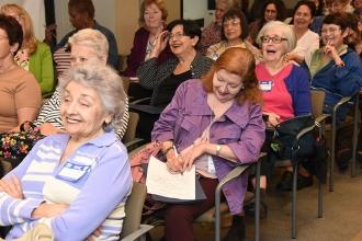 The workshop leader gets some laughs in the Madame Justice workshop.