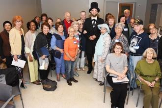 Those attending the From Railsplitter to President workshop take a group shot with “Honest Abe.”