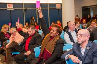  UFT delegates raise their placards during the Feb. 7.