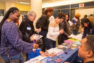 Attendees check out the exhibits from the events and interact with other members at the conference. 