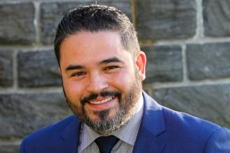 Portrait of a bearded brunette man smiling