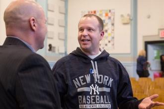 Physical Therapist talking to Mulgrew following a meeting