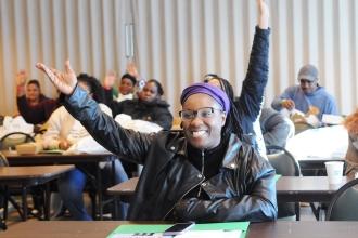 Taisha Ceasar, mom to middle school twins and one high school student, is all smiles at the beginning of the UFT Brooklyn Parent Conference.