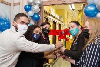 Doing the honors at the Longwood Academy of Discovery in the Bronx are (from left) state Assemblyman Kenny Burgos, Chapter Leader Stephanie Sangosse, Principal Victoria Najera, Teacher Center site coach Veronica Vadi and UFT District 8 Representative Karen Aldorando.