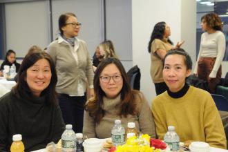 A group of school psychologists at a table pose for a photo during 2026 UFT Clinicians Appreciation Day. 