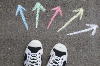 Sneakers showing arrows pointing in different directions