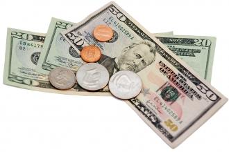 50 and 20 US dollar bills with coins