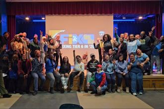 Members at PS 373 in Brooklyn raise their hands in support of fixing Tier 6.
