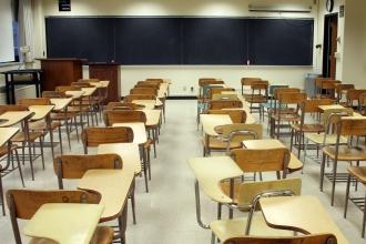 Empty classroom full of desks