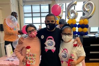 Chapter Leader Luis Gonzalez is flanked by speech therapist Rebecca Teitelbaum (left) and Minerva Leonardo, a special ed teacher and breast cancer survivor, at PS 469 at PS 277 in the Bronx.