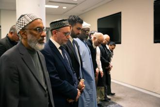 UFT members, guests, and NYC Mayor Zohran Mamdani pray together during the UFT Muslim Education Committee's annual Iftar celebration. 