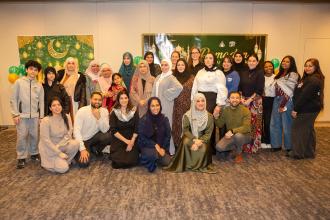 Brooklyn members and guests gather to commemorate the UFT's annual Iftar dinner with a photo.