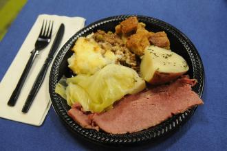Corned beef and cabbage is a signature meal enjoyed by attendees.