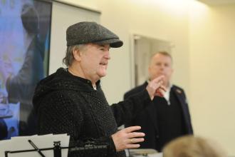 John McDonagh, a playwright, performer and activist, shares his story with members attending the event.