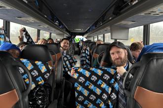 Bronx high school and District 75 members show off their UFT “Fix Tier 6” swag as they travel to Albany aboard one of 28 buses provided by the UFT.