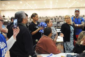Members from Districts 14 and 32 in Brooklyn discuss fixing Tier 6 and other issues as they meet with state Assembly Member Maritza Davila (standing, right).