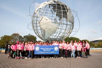 Members from William Cullen Bryant HS take a group photo in their matching pink attire in front of the Fountain of the Planets at Flushing Meadows Corona Park during the Queens Making Strides Against Breast Cancer walk on October 19. 