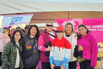 Members taking part in the walk on Long Island are all smiles at Jones Beach State Park on Oct. 19.