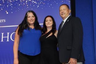 Teachers smile on stage after receiving their awards at the inaugural UFT Middle School Awards on May 15, 2025. 