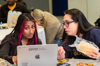 Two teachers discuss workshops during their lunch break at the UFT Middle School Awards on Feb. 7, 2026