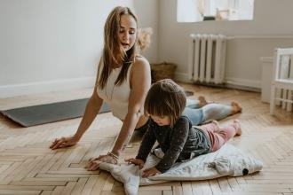 Woman and child doing yoga together