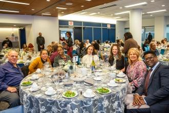 New retirees from District 27 in Queens enjoy the luncheon together.