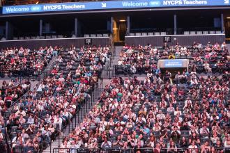 More than 3,000 newly hired teachers fill the arena at Barclays Center.