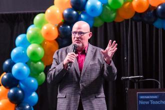 UFT President Michael Mulgrew tells the new teachers gathered about his first year as a New York City public school teacher