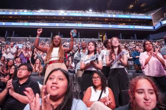 New teachers cheer in the stands at the Barclays Center.