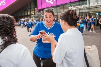 New teachers are assisted with a smile outside the arena by Jeanine Santopietro