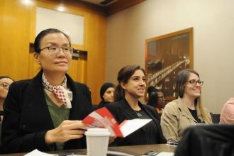Nurses, including Ning Ye (left), a nurse at NYU Langone Hospital–Brooklyn, listen attentively during a professional development workshop.
