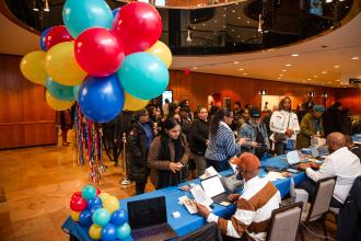 Colorful balloons and decor bring appropriate cheer to the registration tables at the Hilton for the UFT Paraprofessional Awards Luncheon on March 7, 2026. 