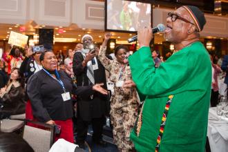 James Tyrone Burris, aka Petawane, a District 75 paraprofessional and singer, treats the crowd to a performance after the UFT Paraprofessional Awards Luncheon.