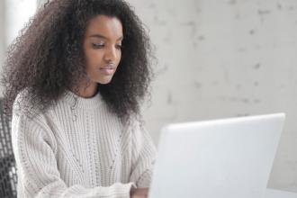 Girl using a computer and working at home