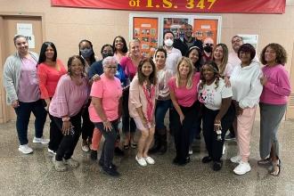 Teachers pose for Pink Day
