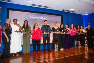 Winners of the Outstanding Professional Services Award accept their trophies.