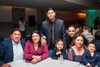 The family of provider Omar Chamorro (standing) join him to celebrate his Outstanding Professional Services Award win.