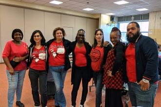 Group of UFT members wearing red