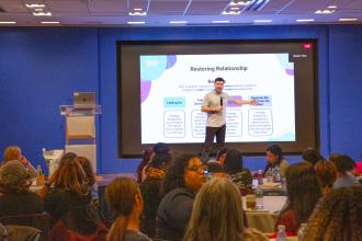 Members listen and take notes as Clay Cook of CharacterStrong leads a workshop on multitiered systems of support in school social work.