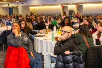 School social workers listen intently to various presenters featured during the event.